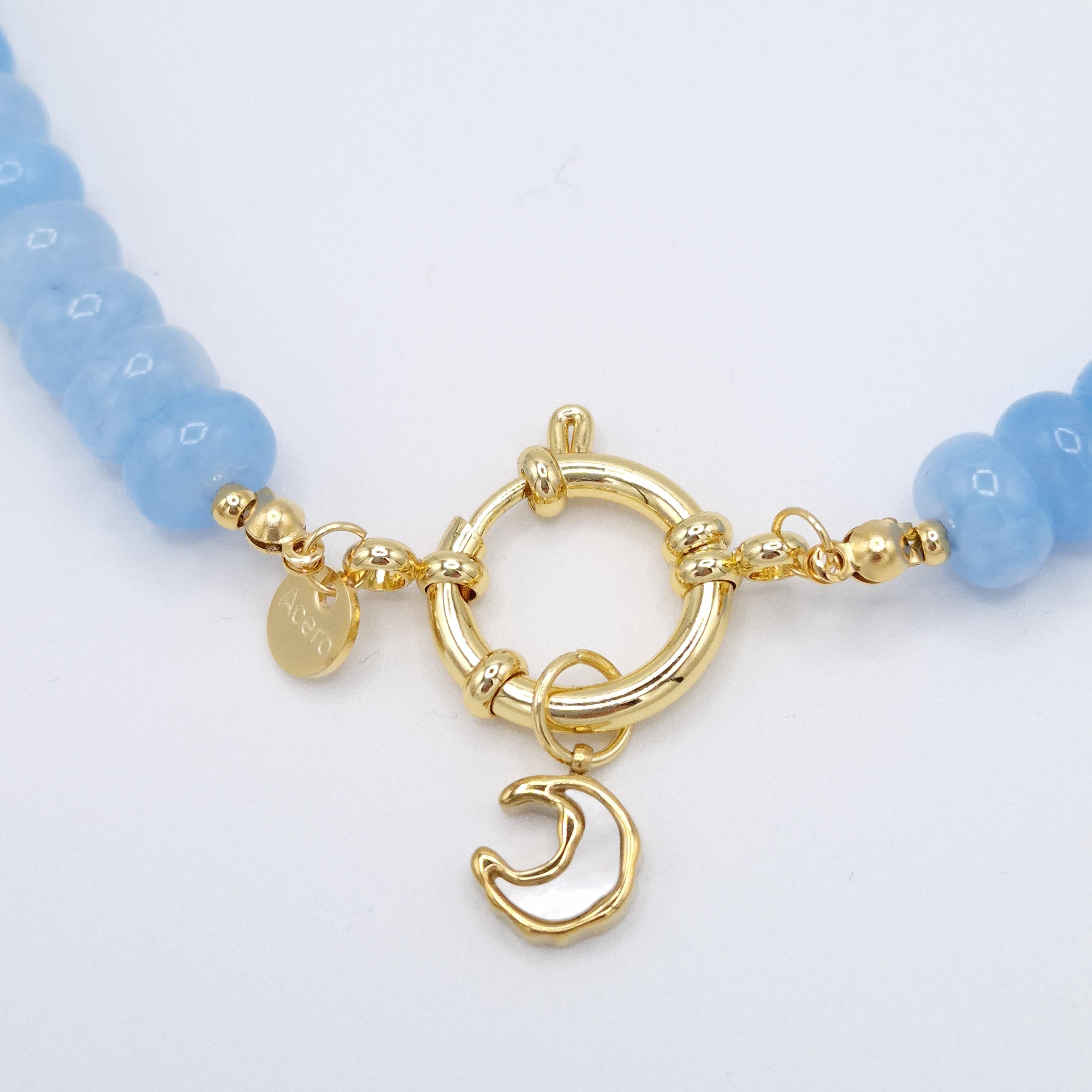 Collar luna creciente nácar azul acero dorado
